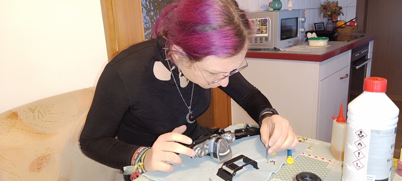 My girlfriend insisted to post this image of me, where I am reassembling my Contax FB
