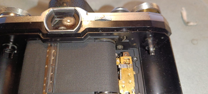 Detailed view to the film transport gear in the film gate cover