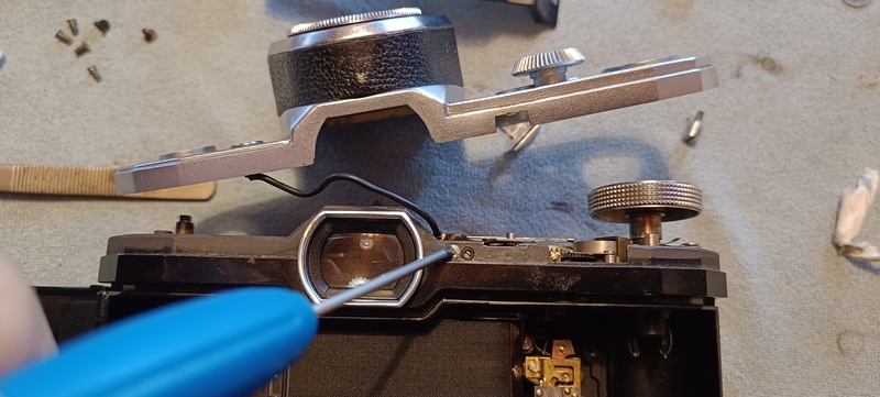 Find this small screw holding the flash contact in position